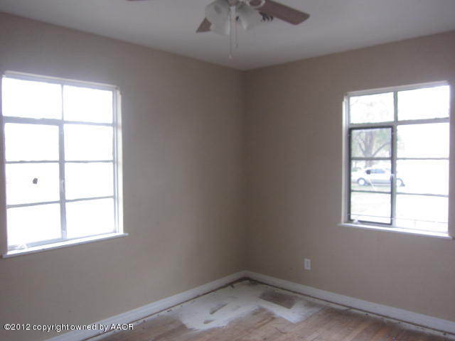 4618 Cline Road Amarillo, TX 79110 - Photo 10 of 10 an empty room with a window