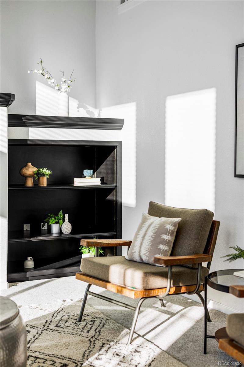 12829 Claude Place Thornton, CO 80241 - Photo 15 of 39 a living room with furniture and wooden floor