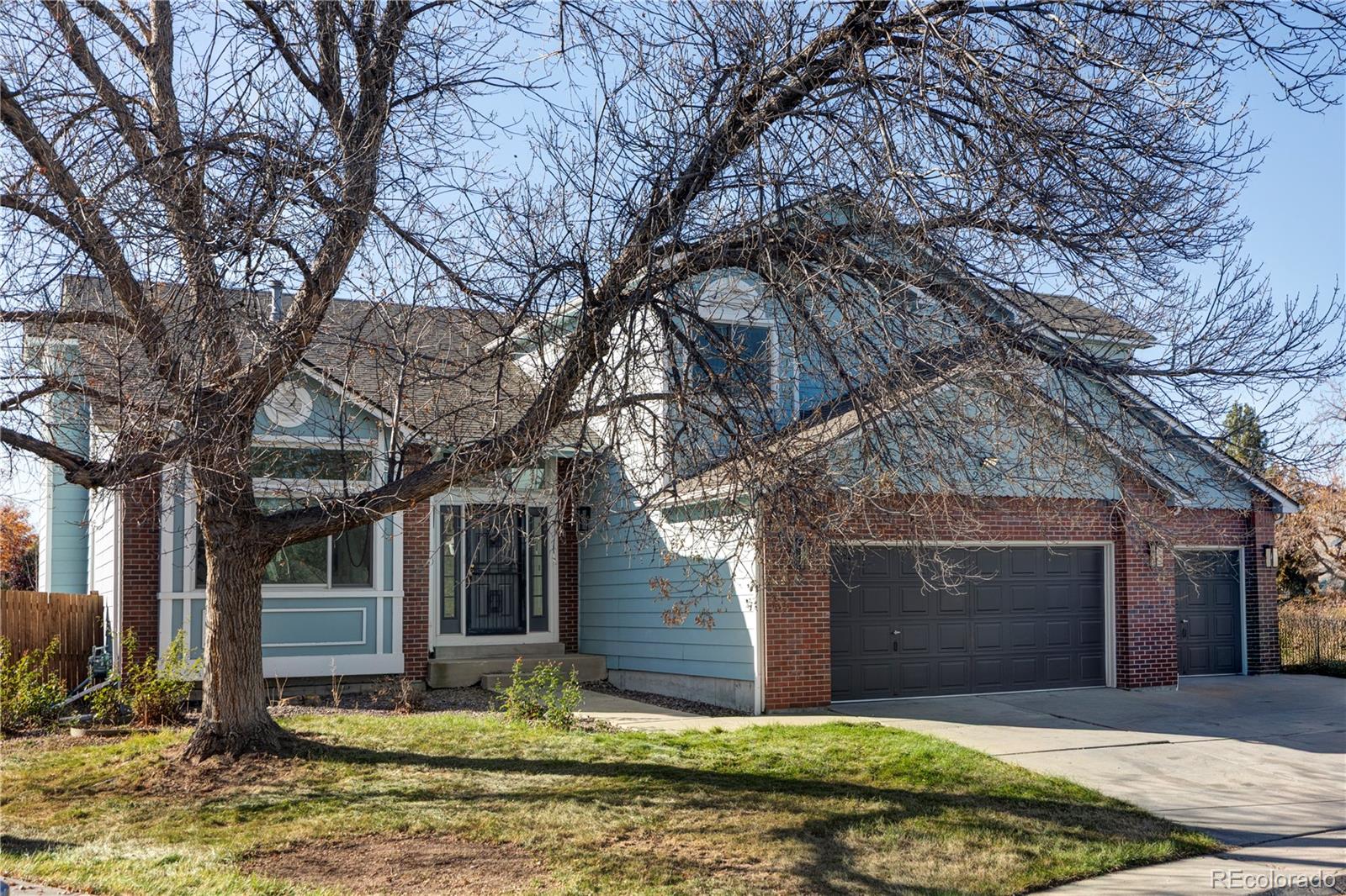 12829 Claude Place Thornton, CO 80241 - Photo 2 of 39 a view of a house with a yard