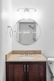 a bathroom with a sink and mirror