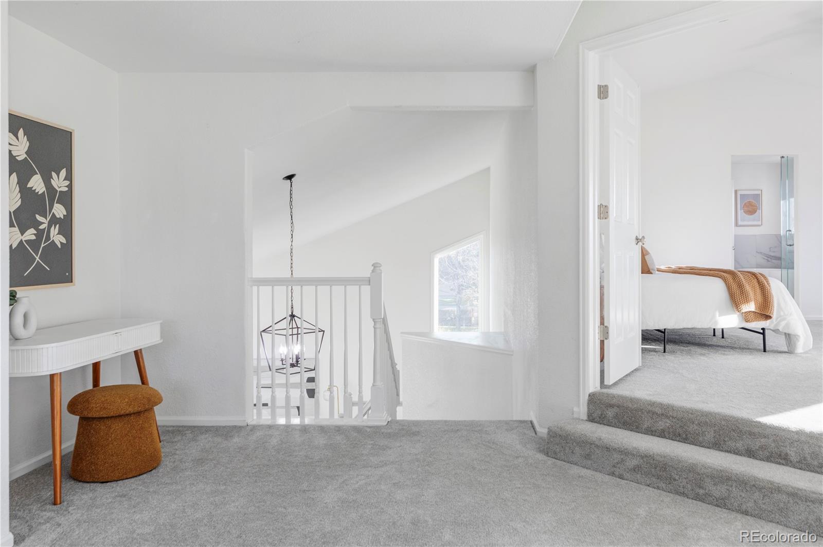 12829 Claude Place Thornton, CO 80241 - Photo 25 of 39 a living room with furniture and a window