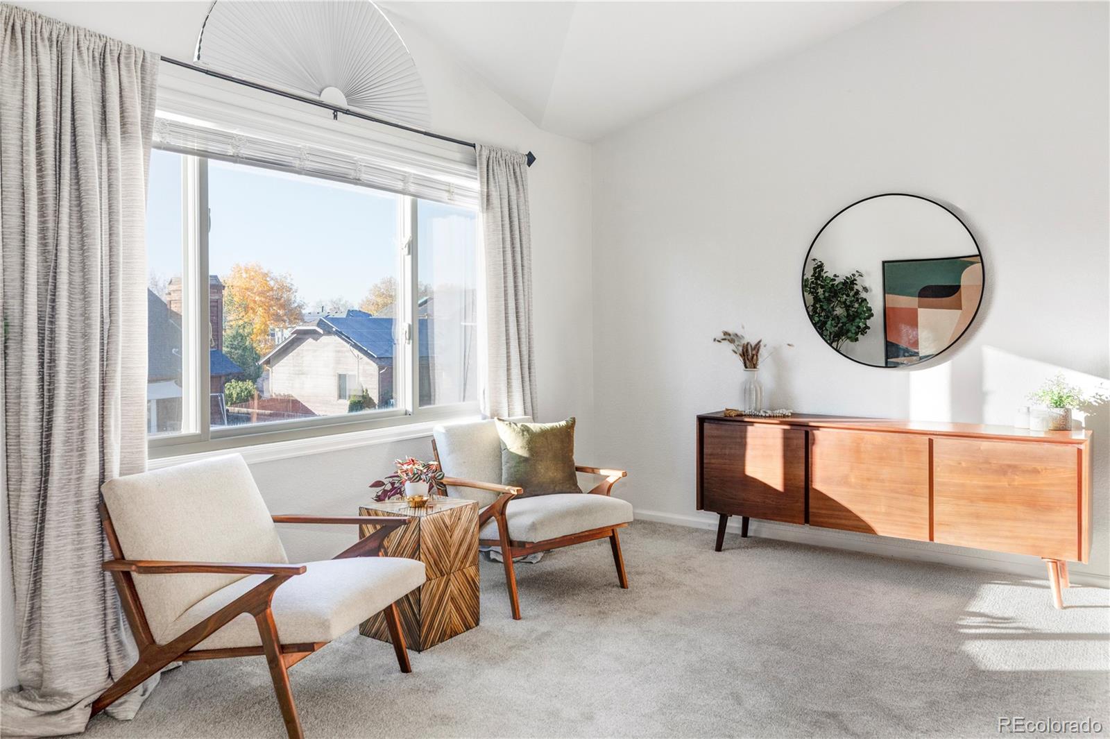 12829 Claude Place Thornton, CO 80241 - Photo 28 of 39 a living room with furniture and a window