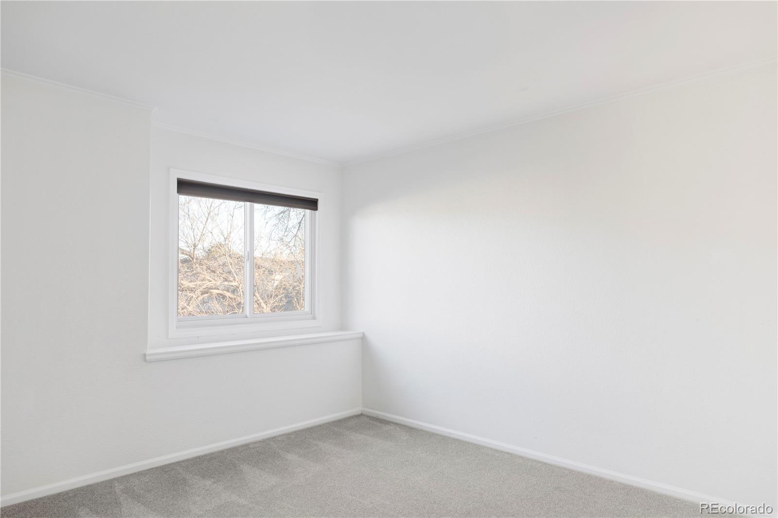 12829 Claude Place Thornton, CO 80241 - Photo 36 of 39 an empty room with a window