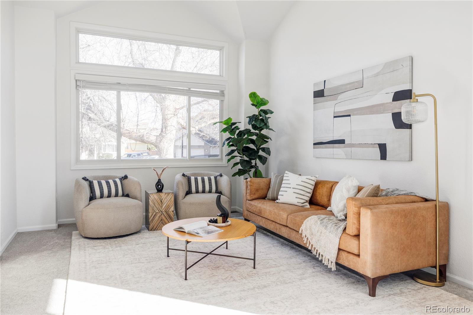 12829 Claude Place Thornton, CO 80241 - Photo 5 of 39 a living room with furniture and a large window