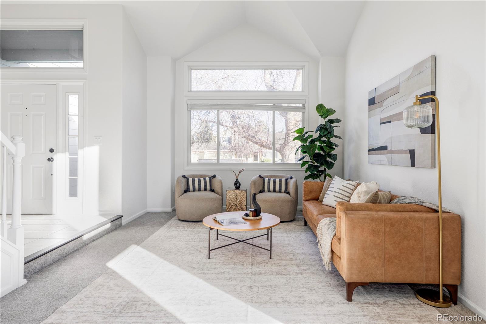12829 Claude Place Thornton, CO 80241 - Photo 7 of 39 a living room with furniture and a large window
