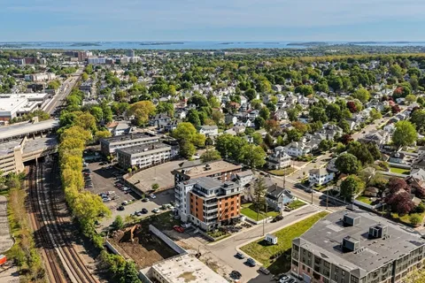 an aerial view of a city with lots of residential buildings