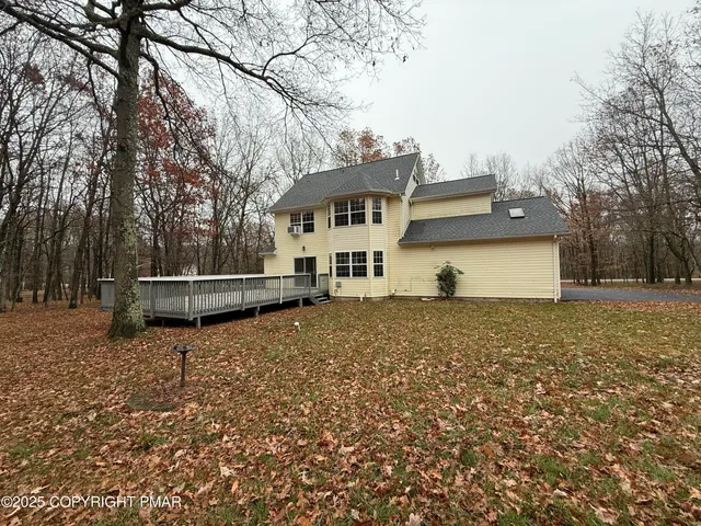 a house with trees in the background