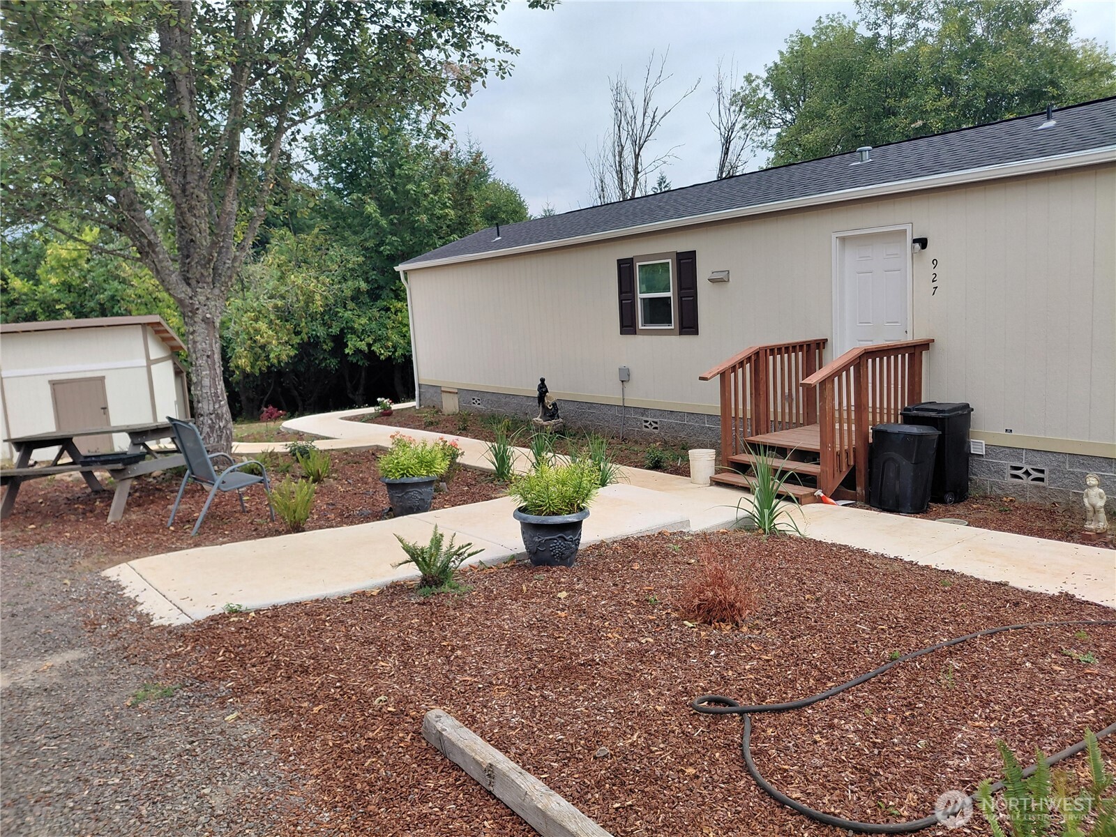 a view of a backyard with sitting area