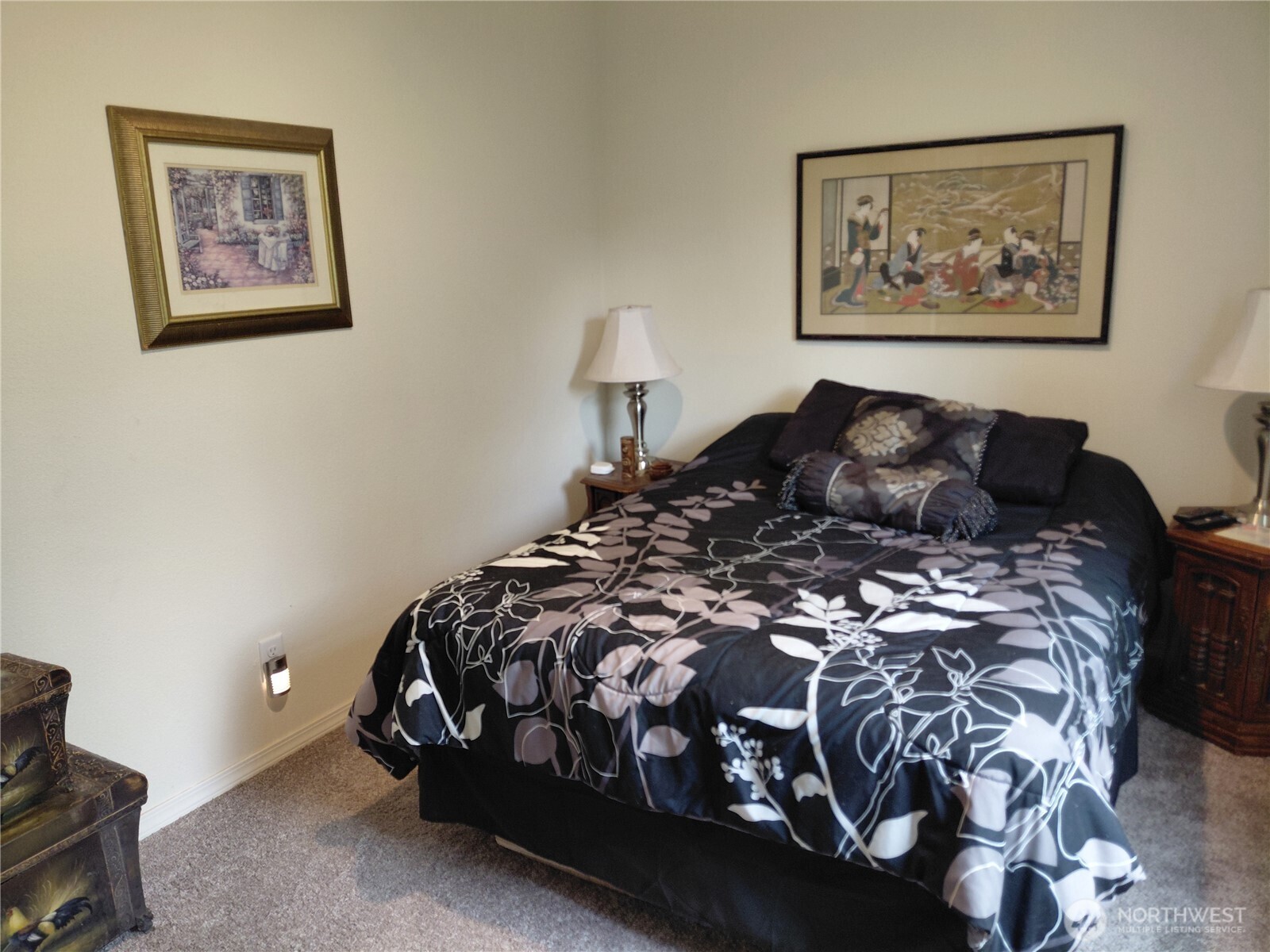 927 Cinebar Road Cinebar, WA 98533 - Photo 19 of 31 a bed sitting in a bedroom next to a wall paintings