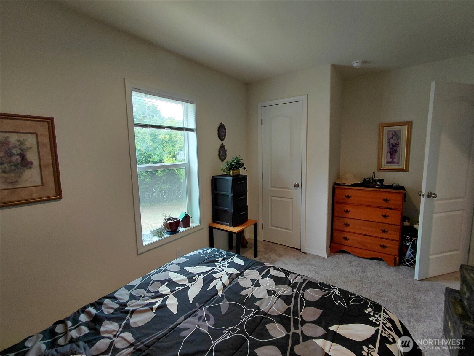 927 Cinebar Road Cinebar, WA 98533 - Photo 20 of 31 a bedroom with a bed and wooden floor