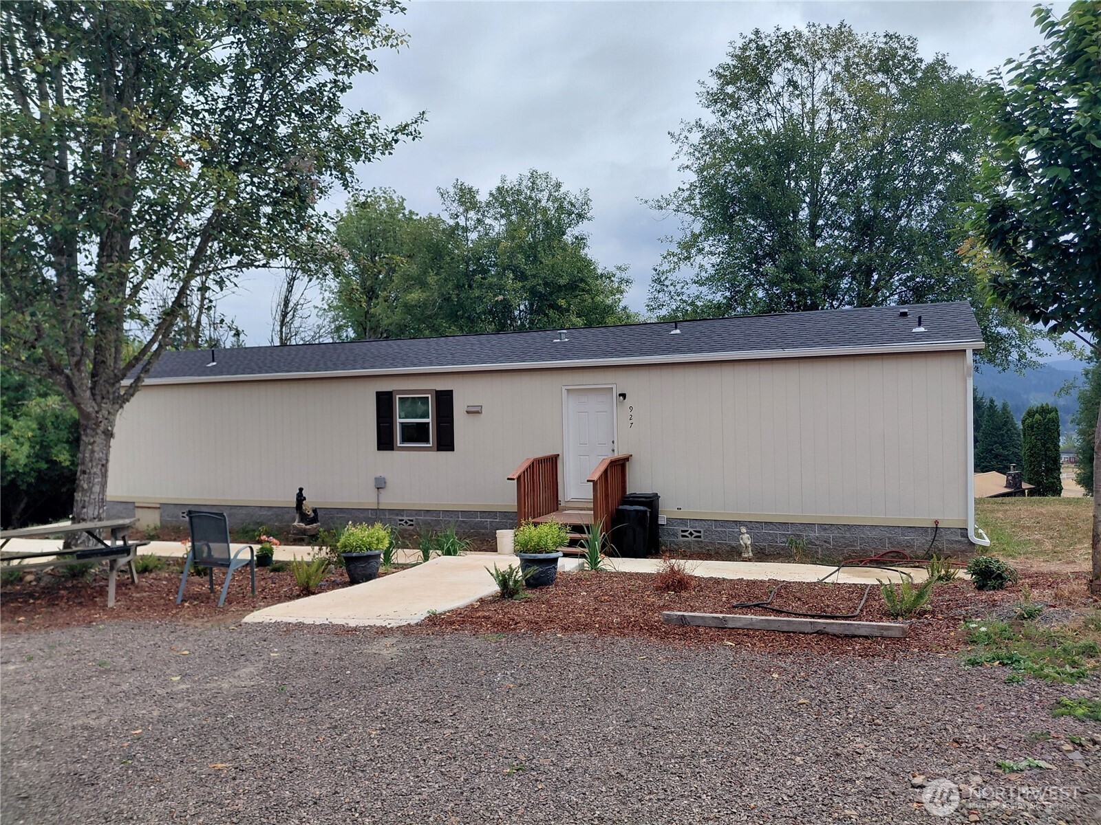 927 Cinebar Road Cinebar, WA 98533 - Photo 2 of 31 a view of a backyard house with table and chairs
