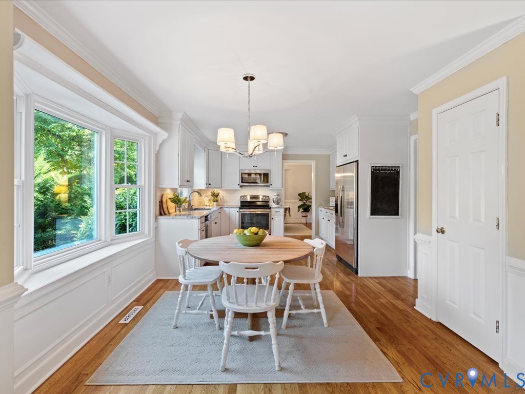 5309 Rock Harbour Road Midlothian, VA 23112 - Photo 11 of 47 a view of a dining room with furniture window and wooden floor