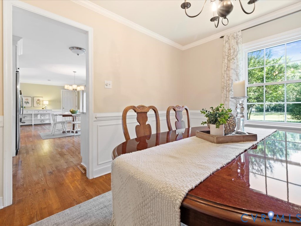 5309 Rock Harbour Road Midlothian, VA 23112 - Photo 21 of 47 a view of a dining room with furniture window and wooden floor