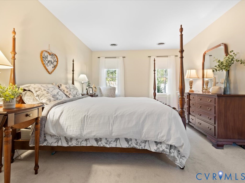 5309 Rock Harbour Road Midlothian, VA 23112 - Photo 23 of 47 a large bed sitting in a bedroom next to a window