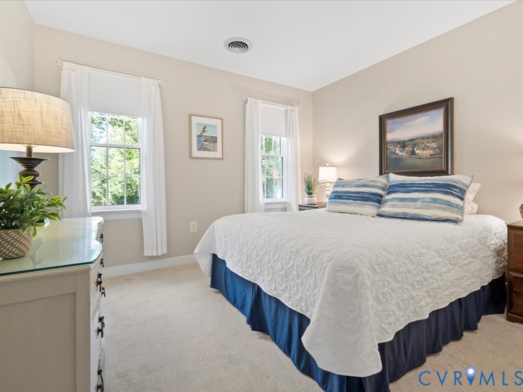 5309 Rock Harbour Road Midlothian, VA 23112 - Photo 25 of 47 a bedroom with a bed and a potted plant