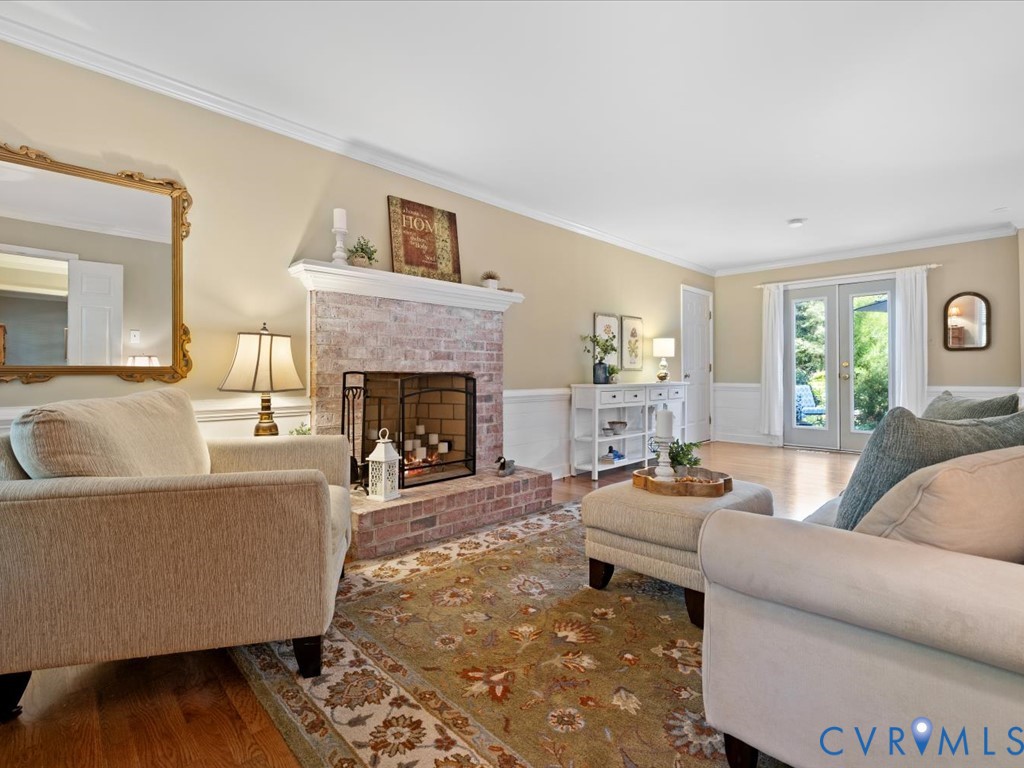 5309 Rock Harbour Road Midlothian, VA 23112 - Photo 7 of 47 a living room with furniture and a fireplace