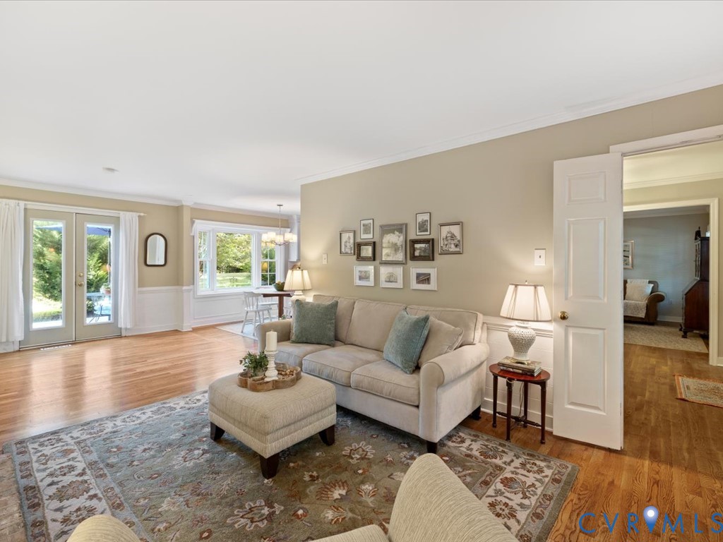 5309 Rock Harbour Road Midlothian, VA 23112 - Photo 9 of 47 a living room with furniture and a wooden floor