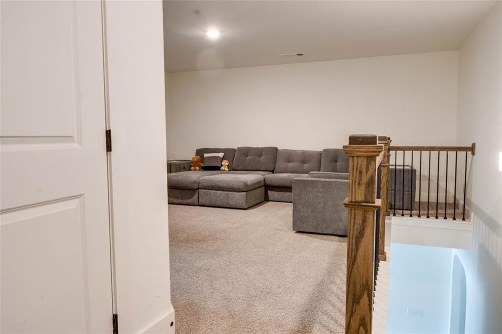 7621 Avalon Boulevard Fairburn, GA 30213 - Photo 13 of 25 a living room with furniture and a walk in closet