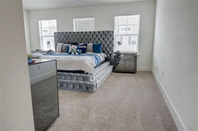 a bed room with a bed and a window