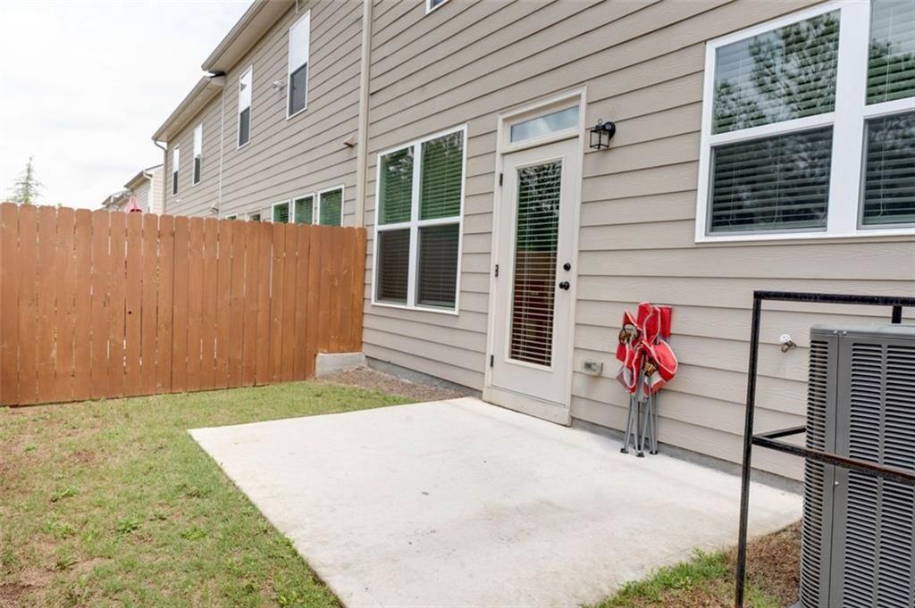 7621 Avalon Boulevard Fairburn, GA 30213 - Photo 24 of 25 a view of a backyard with a patio