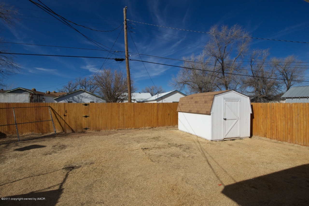 4322 South Polk Street Amarillo, TX 79110 - Photo 12 of 13 Backyard with Storage Building