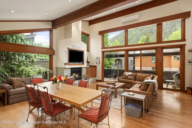 a view of a dining room with furniture window and outside view