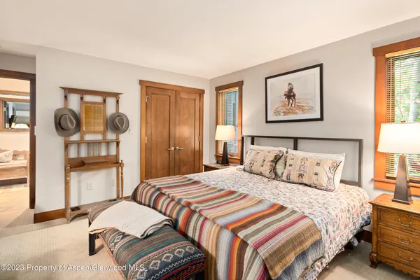 a bedroom with a bed and a cabinets