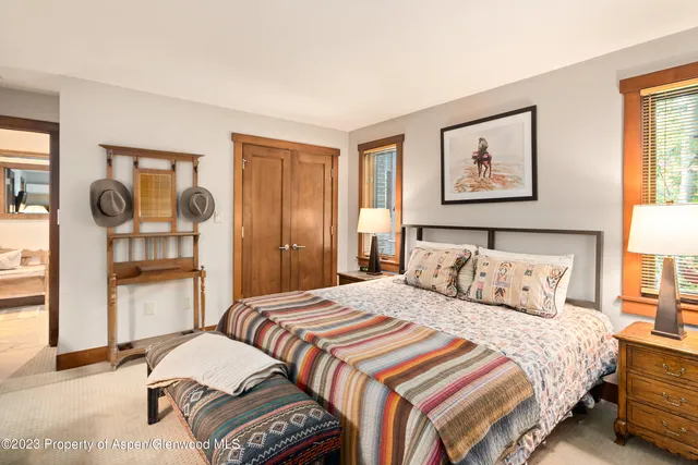 a bedroom with a bed and a cabinets