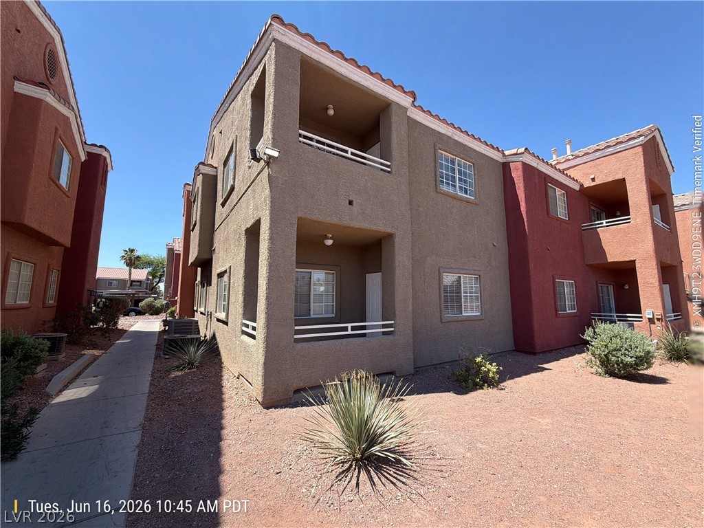 4730 East Craig Road, Unit 1124 Las Vegas, NV 89115 - Photo 22 of 22 A terracotta-tiled roof crowns this stucco-finished building, offering multiple private balconies.