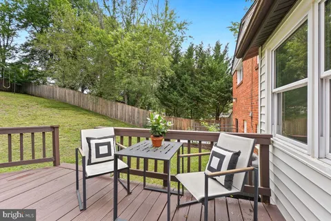 a view of chair and table on the deck