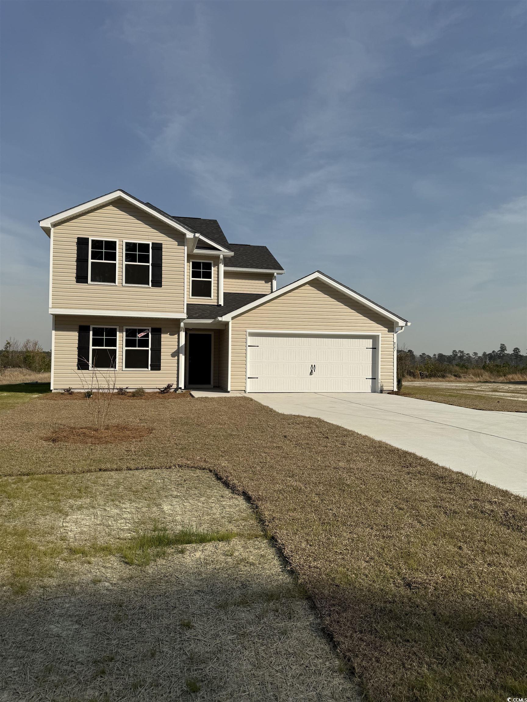 807 Busy Corner Road Conway, SC 29527 - Photo 1 of 21 View of front facade featuring a garage and concre