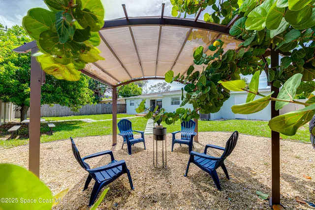 a view of a chairs and table in the patio
