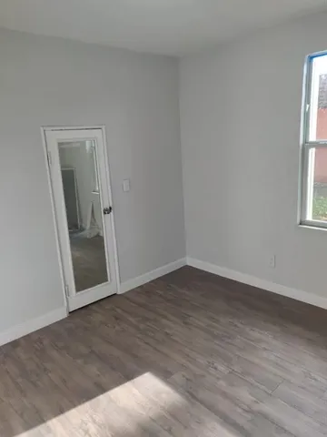 a view of a house with a backyard and balcony