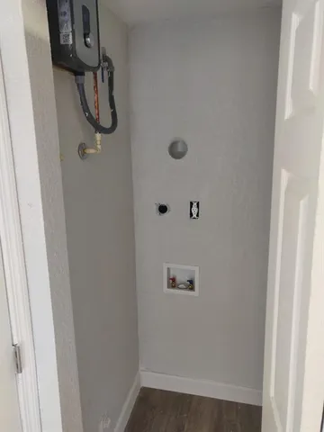 a bathroom with a toilet and a bath tub