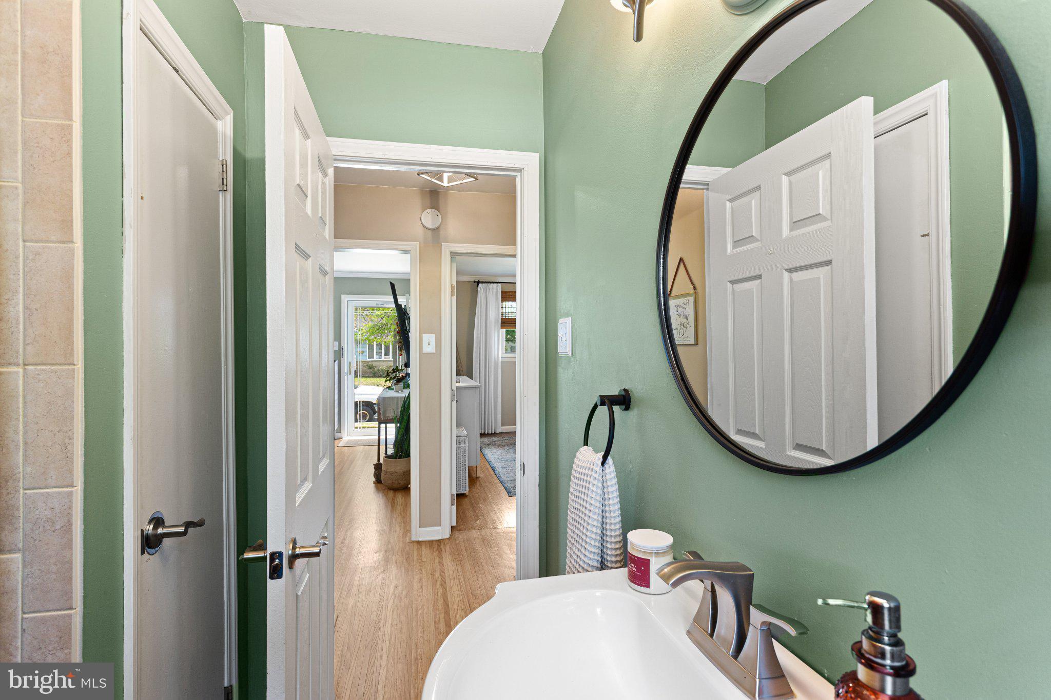 725 West 3rd Avenue Runnemede, NJ 08078 - Photo 11 of 35 a bathroom with a mirror a sink and a mirror