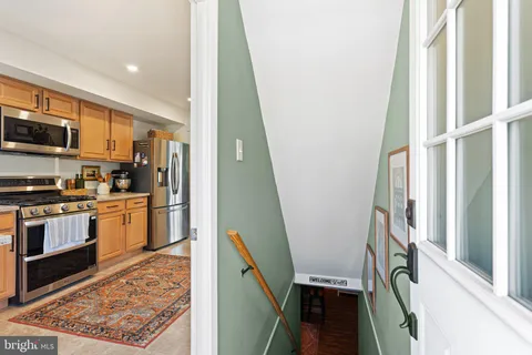 a view of a kitchen from the entryway