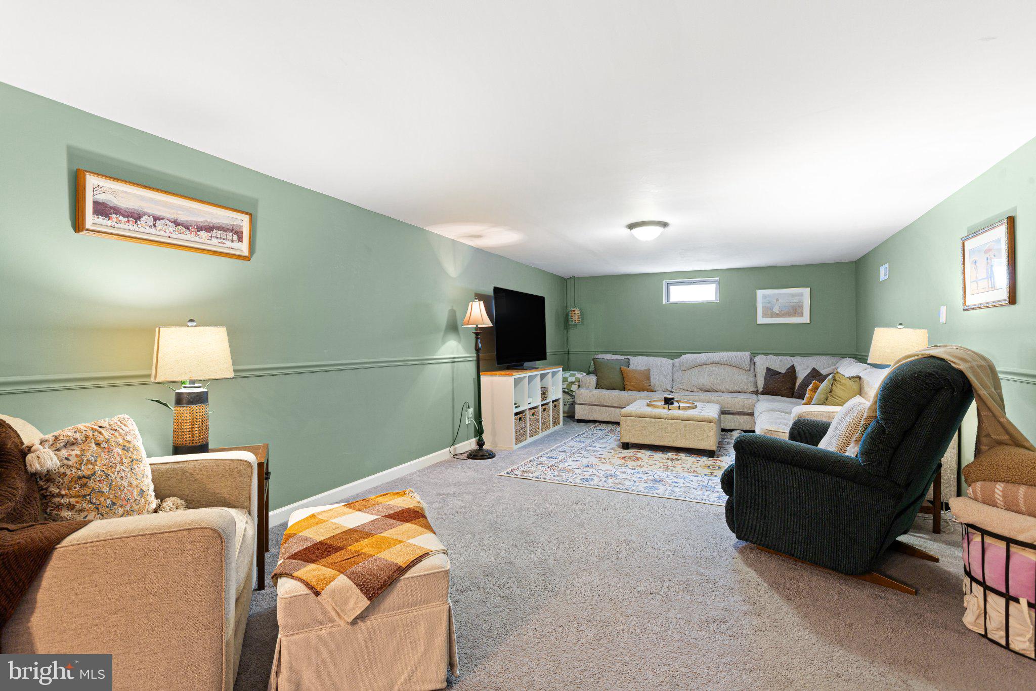 725 West 3rd Avenue Runnemede, NJ 08078 - Photo 26 of 35 a living room with furniture and a flat screen tv