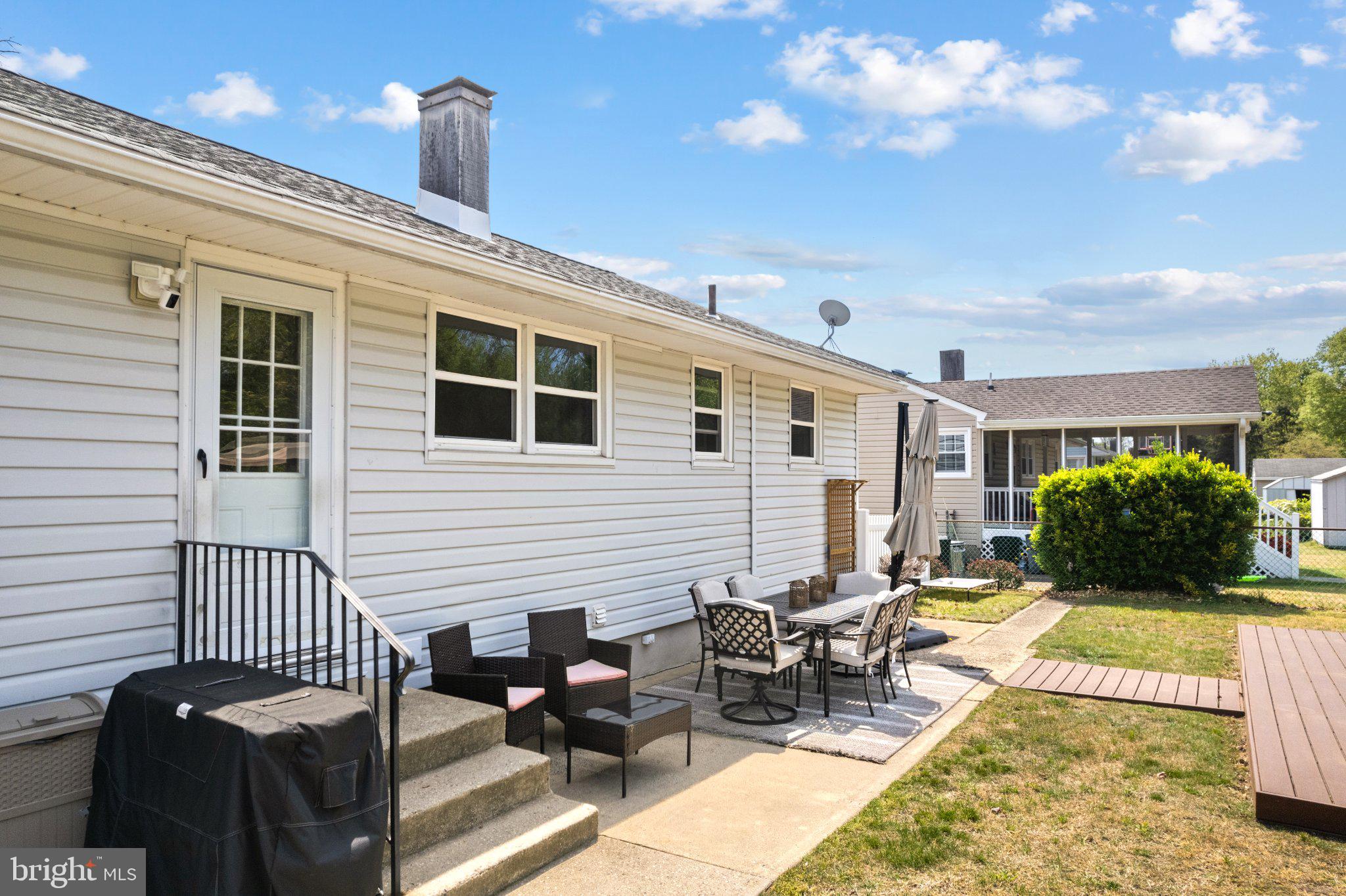 725 West 3rd Avenue Runnemede, NJ 08078 - Photo 29 of 35 a view of a patio with couches table and chairs and potted plants