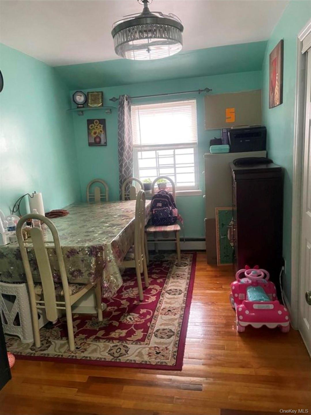 144-15 Lux Road Queens, NY 11435 - Photo 6 of 7 a living room with furniture and a table