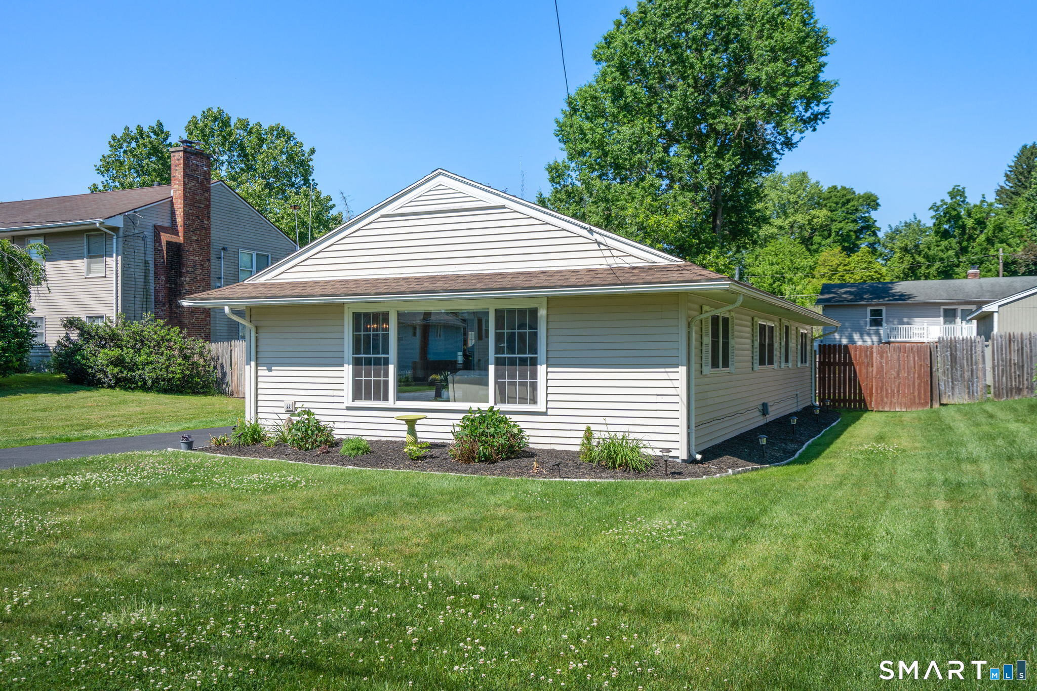 31 Cowan Street Suffield, CT 06078 - Photo 28 of 29 a front view of a house with yard and green space
