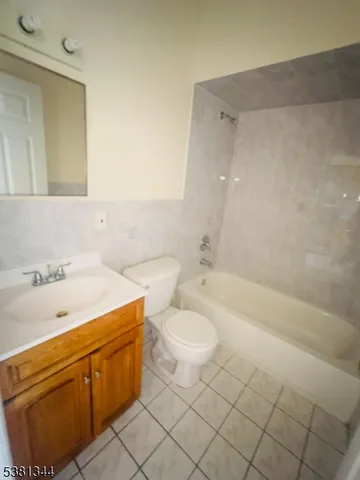 a bathroom with a sink a toilet and bathtub