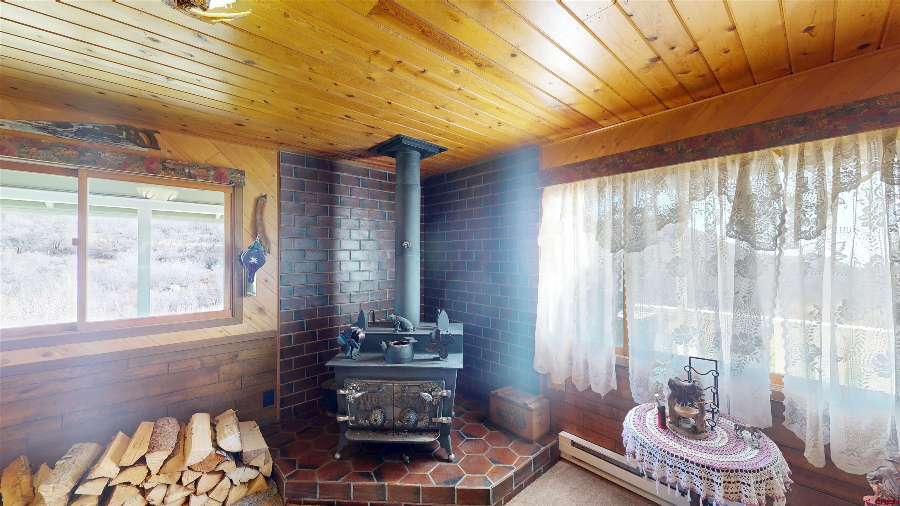 19253 Stevens Gulch Road Paonia, CO 81428 - Photo 24 of 43 a living room with furniture and a window