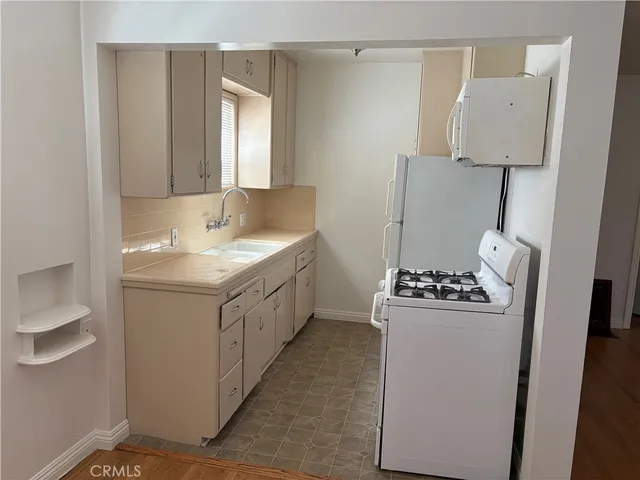 a bathroom with a sink toilet and mirror