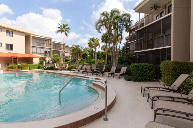 a view of a swimming pool with a lounge chairs