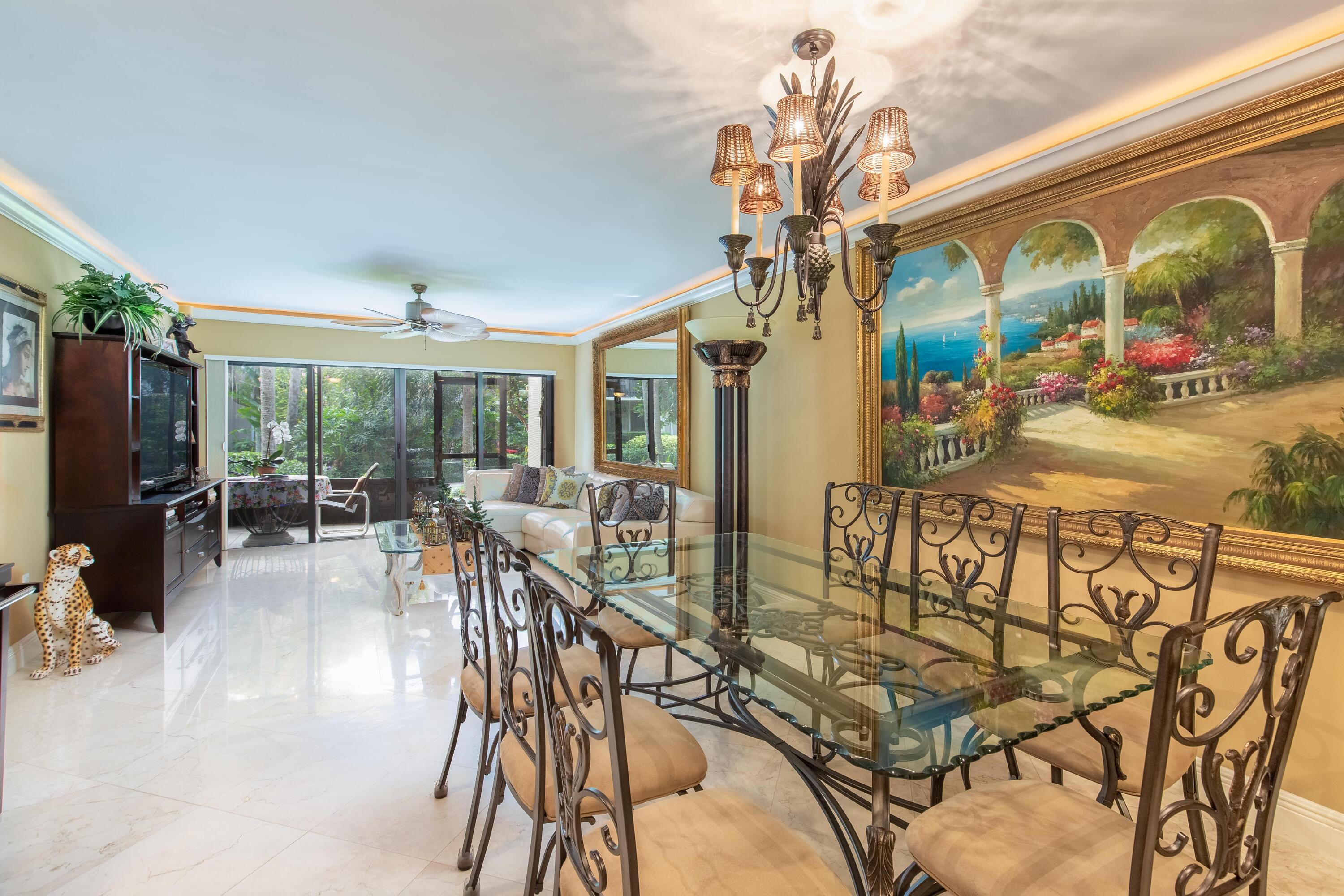 3605 South Ocean Boulevard South, Unit 103 South Palm Beach, FL 33480 - Photo 3 of 18 a dining room with furniture water view and a floor to ceiling window