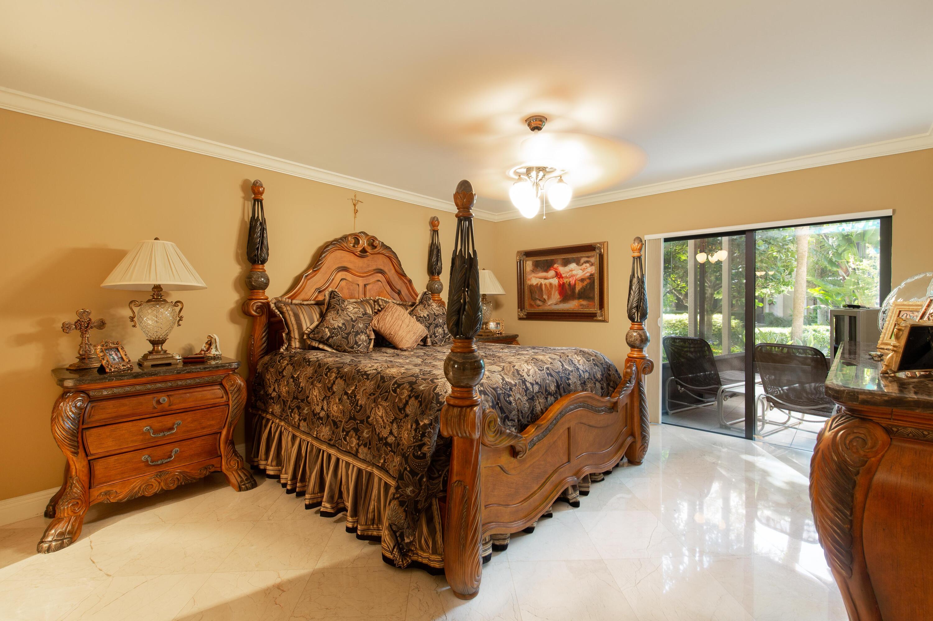 3605 South Ocean Boulevard South, Unit 103 South Palm Beach, FL 33480 - Photo 4 of 18 a bed room with a bed window and a television