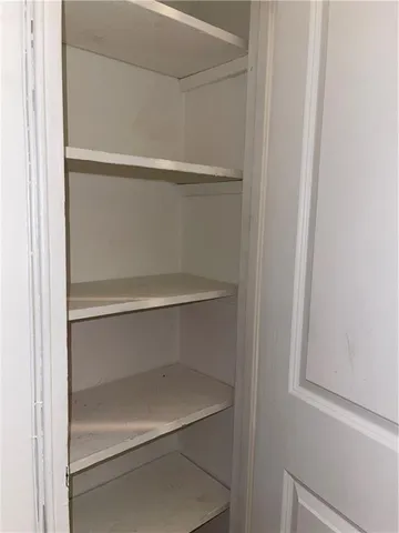 a view of an empty walk in closet
