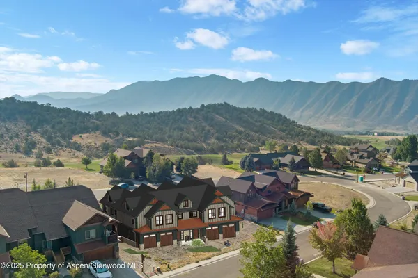 a view of a town with mountains in the background