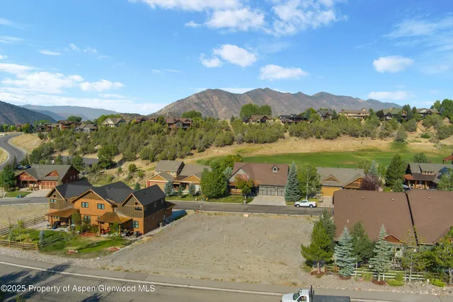 a view of a city with mountains in the background