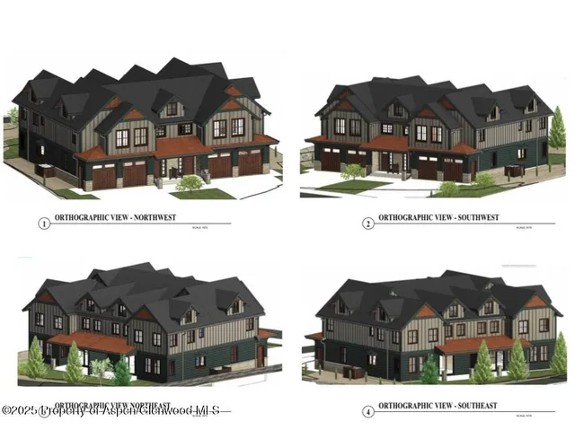 a view of houses with a yard